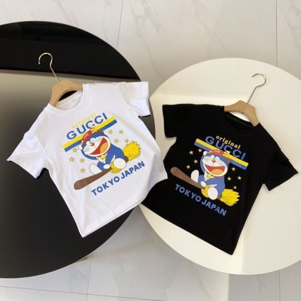 グッチグッチドラえもん 定番ロゴと東京モチーフ 子供 T シャツGUCCI 子供向け T シャツ GUCCI 子供服ドラえもんをイメージした柄白黒 T シャツグッチ快適な素材ハイファッションな子供衣装
